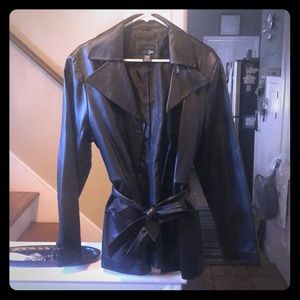 Black leather jacket with belt.
